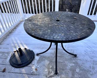 Outdoor table, umbrella stand. Umbrella and outdoor chairs available. 