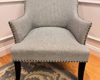 Fabric chair with nailhead trim by Pier 1