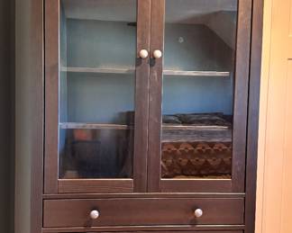 IKEA Hemnes black glass front storage cabinet with shelves and 3 drawers