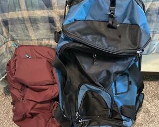 REI co-op Ruckpack back pack and FUL workhorse rolling duffel bag.