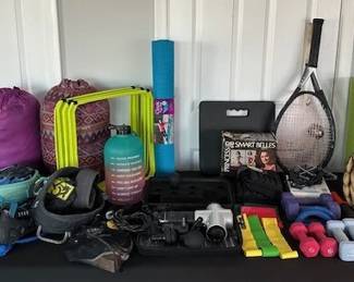 Variety of work out equipment and accessories, baseball gloves, sleeping bags, etc.