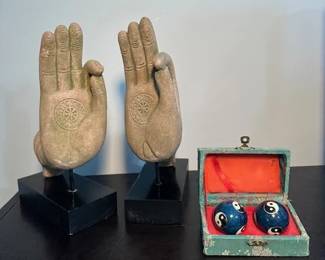 Mudra Cast Sandstone Hands and Chinese Baoding balls, also known as medication balls.
