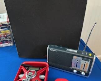 Subwoofer, Emerson RP6250 AM/FM radio and Eton Frx3 hand crank AM/FM weather alert radio.