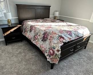 Queen-sized bed with mattresses (storage drawers) and matching side tables.