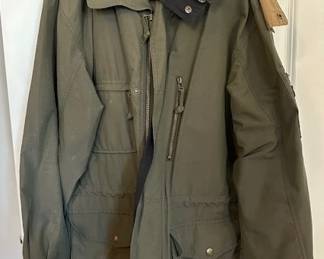 Woolrich men's jacket with a plaid flannel lining, size L.