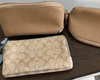 2 Cosmetic bags by Leatherology and Coach zip wallet.