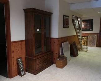 hallway  in  finished lower  level  with  gun  safe  and  pictures