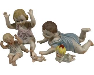 2455 - Group Porcelain Piano Babies
