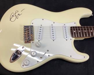 ERIC CLAPTON AUTOGRAPHED FENDER 6 STRING ELECTRIC GUITAR WITH CERTIFICATE OF AUTHENTICITY FROM AUTOGRAPH STORE NY, NY. ORIGINALLY FEATURED IN A BENEFIT AUCTION AT CHAPEL HILL 2014. INCLUDES FRAMED TIME PIECES VINYL ALBUM, BEST OF EC CD AND FRAMED PHOTO