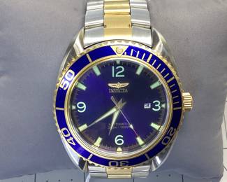 INVICTA 4796 AUTOMATIC WATCH THIS WATCH FEATURES GOLD AND BRUSHED STAINLESS CONSTRUCTION WITH BLUE BEZEL AND DIAL.