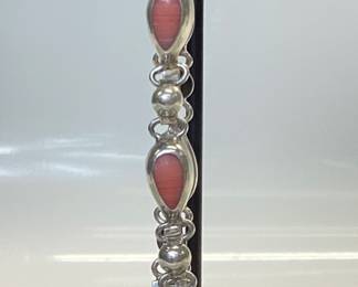 STERLING SILVER BRACELET AND EARRING SET THIS PINK CORAL MATCHING JEWELRY SET WEIGHS 23.87 GRAMS. BRACELET IS 8 INCHES