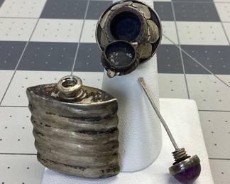 VTG POISON RING AND PERFUME BOTTLE THESE ARE MADE OF STERLING SILVER. POISON RING FEATURES ABALONE, SECRET COMPARTMENT AND ADJUSTABLE SIZE. THE PERFUME OR SNUFF BOTTLE FEATURES A CABOCHON AMETHYST ON THE TOPPER. TOTAL WEIGHT IS 17.03 GRAMS. PATINA HAS BEEN LEFT TO PRESERVE PIECES.