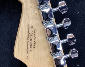 ERIC CLAPTON AUTOGRAPHED FENDER 6 STRING ELECTRIC GUITAR WITH CERTIFICATE OF AUTHENTICITY FROM AUTOGRAPH STORE NY, NY. ORIGINALLY FEATURED IN A BENEFIT AUCTION AT CHAPEL HILL 2014. INCLUDES FRAMED TIME PIECES VINYL ALBUM, BEST OF EC CD AND FRAMED PHOTO