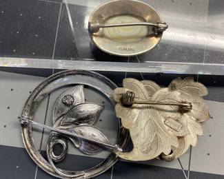VTG 3 BROOCH STERLING LOT MCM CURTIS CREATION FLORAL WITH 1CT HEMATITE, BEAUCRAFT INC LEAF BROOCH AND CABOCHON PINK CORAL BROOCH ALL SET IN STERLING SILVER. TOTAL WEIGHT IS 15.43 GRAMS