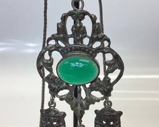 ANTIQUE SILVER JEWELRY LOT EARLY 20TH CENTURY COMMEDIA DELL'ARTE RENAISSANCE REVIVAL PENDANT (POSSIBLE PERUZZI OR COPPINI DESIGNED) SET IN 800(80%) SILVER FEATURING A CABOCHON CHRYSOPRASE. THE ANTIQUE PIECE IS HUNG FROM A 24 INCH STERLING BOX LINK CHAIN. WEIGHT 26.56 GRAMS. ALSO AN ANTIQUE STERLING SCRIMSHAW RING WITH LIONS HEAD ETCHING. WEIGHT IS 9.42 GRAMS, SIZE 6.5. RING HAS SIGNS OF AGE AROUND THE OUTER DIAMETER. PATINA HAS BEEN KEPT TO PRESERVE THESE PIECES