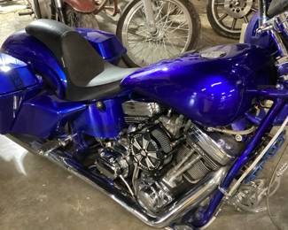 2021 HARLEY DAVIDSON VIN: 4EMEW2E3YN151010 Color: BLUE 2021 CUSTOM HARLEY DAVIDSON w REVTECH 6 SPEED TRANSMISSION, ENGINE CODE 58505 with 6 SPEED HIGHWAY TRANSMISSION, CUSTOM BLUE PAINT, AFTER MARKET GRIPS, CUSTOM RIMS, FREEDOM PERFORMANCE PIPES,