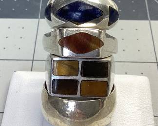 4 STERLING MENS RING LOT SIZE 13.5 WITH SINGLE MARQUISE TIGER'S EYE, SIZE 9 WITH QUADRANT TIGER'S EYE AND JASPER INLAY, SIZE 9.5 WITH 3 AZURITE INLAYS AND SIZE 11.5 BAND 10MM WIDE TOTAL WEIGHT IS 30.91 GRAMS