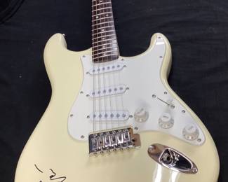 ERIC CLAPTON AUTOGRAPHED FENDER 6 STRING ELECTRIC GUITAR WITH CERTIFICATE OF AUTHENTICITY FROM AUTOGRAPH STORE NY, NY. ORIGINALLY FEATURED IN A BENEFIT AUCTION AT CHAPEL HILL 2014. INCLUDES FRAMED TIME PIECES VINYL ALBUM, BEST OF EC CD AND FRAMED PHOTO