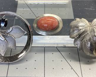 VTG 3 BROOCH STERLING LOT MCM CURTIS CREATION FLORAL WITH 1CT HEMATITE, BEAUCRAFT INC LEAF BROOCH AND CABOCHON PINK CORAL BROOCH ALL SET IN STERLING SILVER. TOTAL WEIGHT IS 15.43 GRAMS