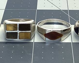 4 STERLING MENS RING LOT SIZE 13.5 WITH SINGLE MARQUISE TIGER'S EYE, SIZE 9 WITH QUADRANT TIGER'S EYE AND JASPER INLAY, SIZE 9.5 WITH 3 AZURITE INLAYS AND SIZE 11.5 BAND 10MM WIDE TOTAL WEIGHT IS 30.91 GRAMS