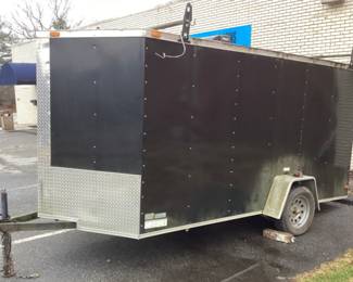 2016 South Georgia Cargo Trailer, V-nose, 12ft Enclosed W Drop Down Back Door & Side Door, Inside Has Shelving On 1 Side.