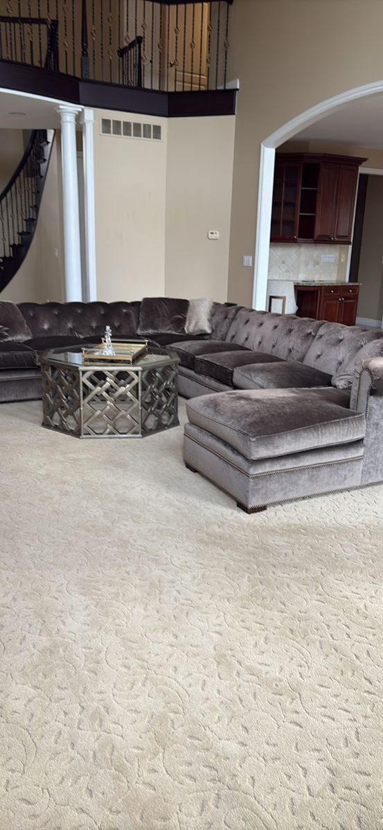 Century brand Tufted sectional. Purchased from Gormans. Transitional style. Gray/olive color. In great condition. Had gold button detail. 6 pillows included. 64 inchesx12 feet x 114 inches- dimensions