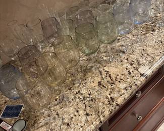 Lots of wine, glasses, cocktail, glasses, martini glasses, and tea cups