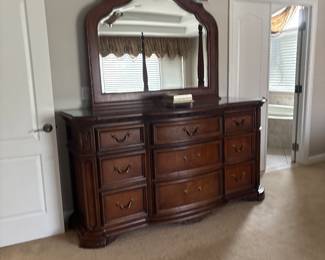 American drill dresser and mirror included in bedroom set