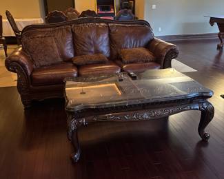 Ashley brand 2 Leather sofas with wood detail. 