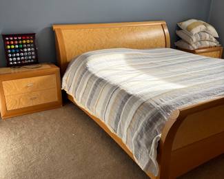 King bedroom set sleigh bed style. Includes king bed, two nightstands, dresser, mirror, and armoire,