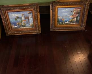 2 oil paintings with ornate wood detail frame 