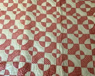 hand stitched drunkards path patterned quilt
