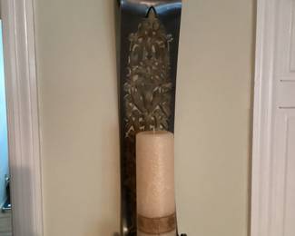 Metal sconce with candle