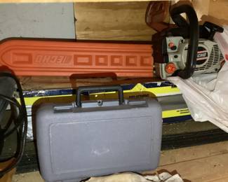 Echo Chainsaw with Orange Blade CoverGray Plastic Tool Case