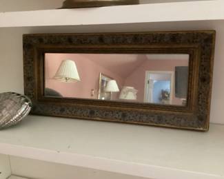 Ornate bordered mirror