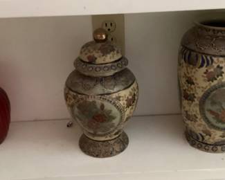 lidded decorate urn with matching vase