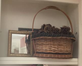 wicker basket with pinecones