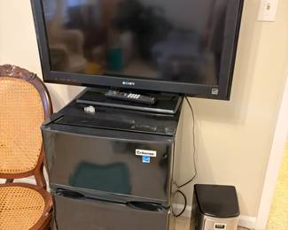 mini fridge, coffee maker. Another TV 