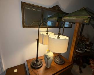 many lamps small tables and mirrors