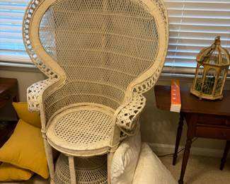 Peacock / cobra style wicker chair. White in color.  $150