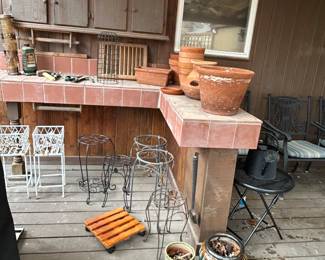 Lots of pots and plant stands 