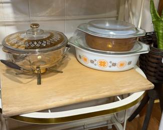 Pyrex Town and Country Oval Casserole Dish, Pyrex Early American brown and gold oval Casserole Dish, Fire-King Georges Briard 22K Gold Floral Covered Casserole Dish with warming stand
