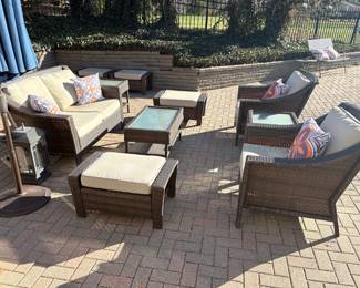 All-season wicker patio set:  2 cushion loveseat, 2 armchairs, 4 ottomans, 2 side tables, 1 coffee table, 1 umbrella and stand