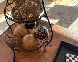 Tiered basket and grapevine and wood accent decor