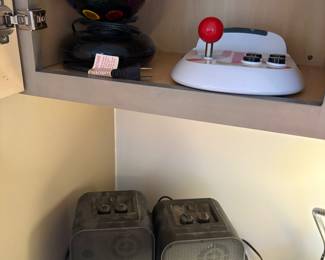 Atari controller, disco ball. and speakers 