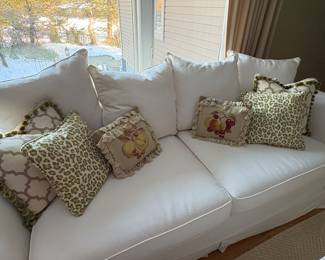 Pottery Barn couch with rolled arms shown with decorative pillows also available (tassel, green leopard and needlepoint - 3 sets of 2)