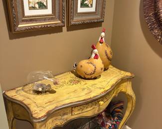 Console entryway table with center drawer, ceramic chickens, rooster and framed prints