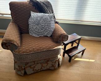 Upholstered armchair and accent pillow