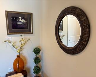 Large round mirror, orange glass vase, faux topiary and framed print
