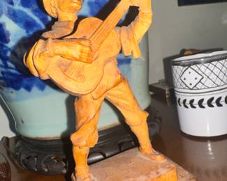Hand carved figure guitar musician